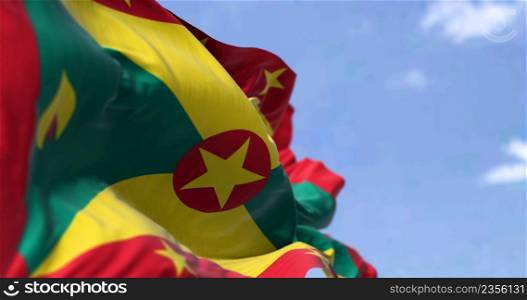 Detail of the national flag of Grenada waving in the wind on a clear day. Grenada is an island country in the West Indies in the Caribbean Sea. Selective focus.