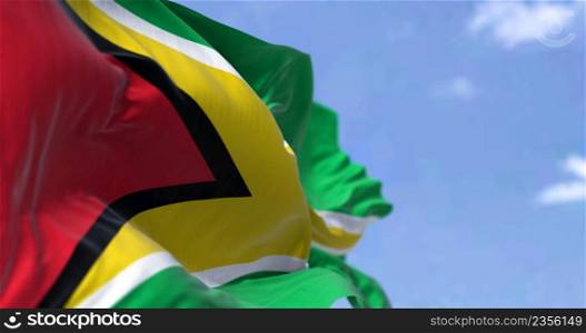 Detail of the national flag of Guyana waving in the wind on a clear day. Guyana is a country on the northern mainland of South America and the capital city is Georgetown. Selective focus.
