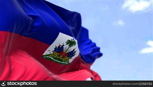 Detail of the national flag of Haiti waving in the wind on a clear day. Haiti is a country located on the island of Hispaniola in the Greater Antilles. Selective focus.