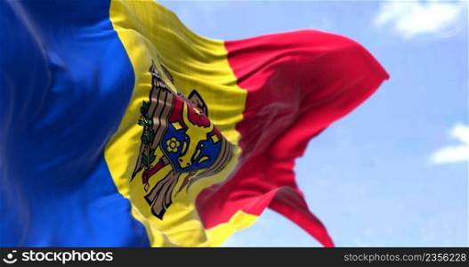 Detail of the national flag of Moldova waving in the wind on a clear day. Moldova is a sovereign state in Eastern Europe. Selective focus.