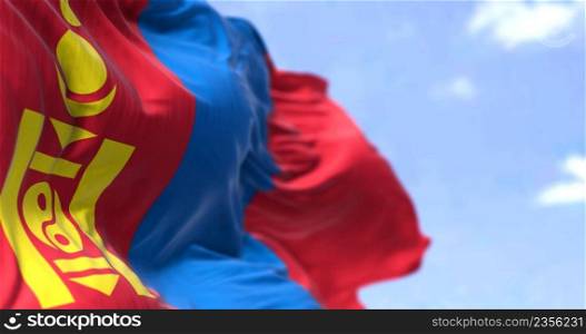 Detail of the national flag of Mongolia waving in the wind on a clear day. Mongolia is a landlocked country in East Asia. Selective focus.