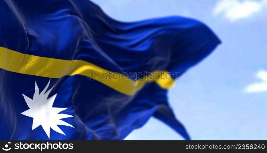 Detail of the national flag of Nauru waving in the wind on a clear day. Nauru is an island country and microstate in Oceania. Selective focus.