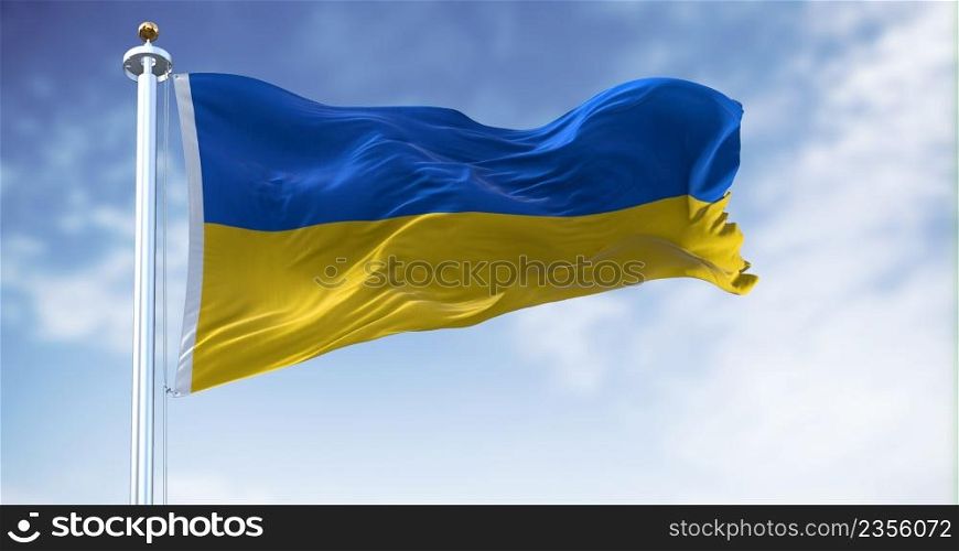 Detail of the national flag of Ukraine waving in the wind on a clear day. Democracy and politics. Eastern Europe country. Patriotism. Selective focus.