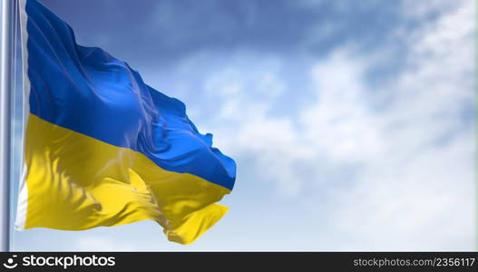 Detail of the national flag of Ukraine waving in the wind on a clear day. Democracy and politics. Patriotism. Selective focus.