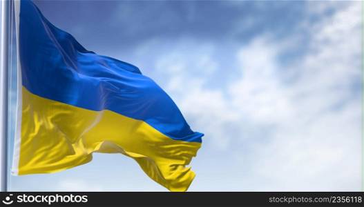 Detail of the national flag of Ukraine waving in the wind on a clear day. Democracy and politics. Patriotism. Selective focus.