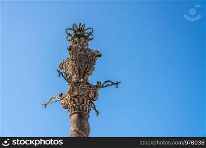 Detail of the ornate carving of the Pillory or Pelourinho by the Se of Oporto in Portugal. Detail of the carved pillory column by Porto cathedral