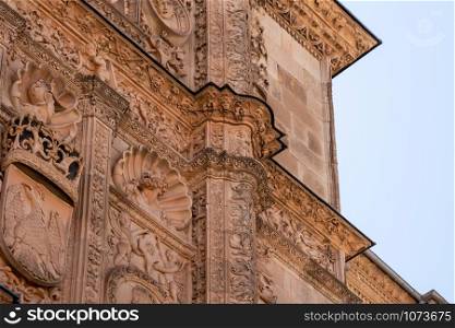 Detail of the ornate facade in the plateresque style at the University of Salamanca in Spain. Ancient Plateresque facade of the building at Salamanca University in Spain