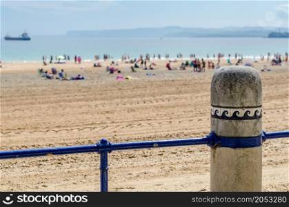 Detail of the railing that separates the promenade from the beach in Santander, Spain