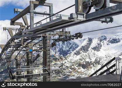Detail of the ski lift on a background of mountains