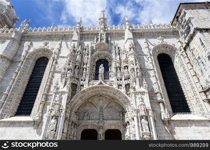 Detail of the south portal of the 16th century Gothic Jeronimos Monastery of the Order of Saint Jerome near the Tagus river in Lisbon, Portugal
