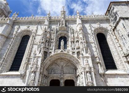 Detail of the south portal of the 16th century Gothic Jeronimos Monastery of the Order of Saint Jerome near the Tagus river in Lisbon, Portugal