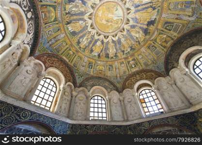Detail of the windows flanked by niches with stucco decorations and figures of the prophets in Baptistery of Neon in Ravenna, Italy