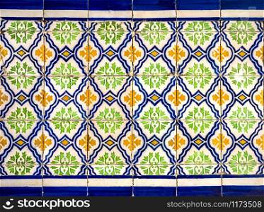 Detail of traditional ceramic tiles covering the external walls of many buildings in the historical centre of the old city of Lisbon, Portugal