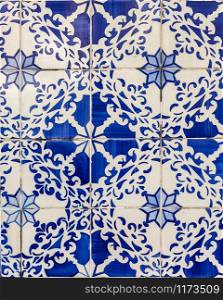 Detail of traditional ceramic tiles covering the external walls of many buildings in the historical centre of the old city of Lisbon, Portugal