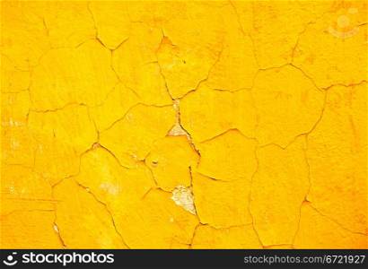 Detail of vintage yellow concrete wall background