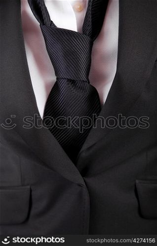 Detail of woman&acute;s suit and tie