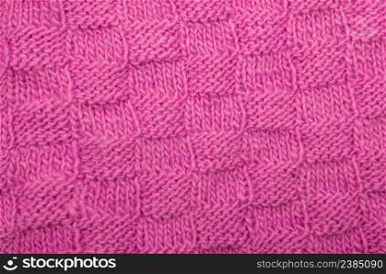 Detail of woven handicraft knit woolen design texture.