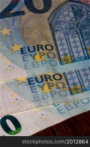 Detail on 20 euro banknote. Close up of banknote laid out on table.