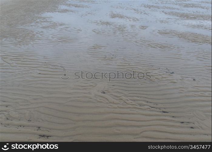 Detail sand ripples at a beach. Detail sand ripples at a beach at ebb tide