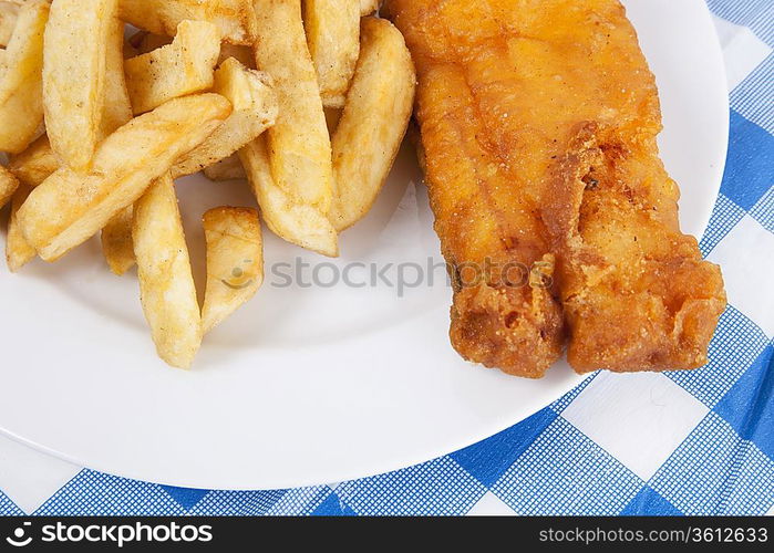 Detail shot of fries and meat on table