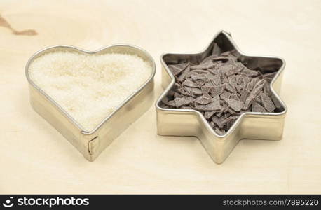 Detailed but simple image of cookie cutter with sugar and chocolate