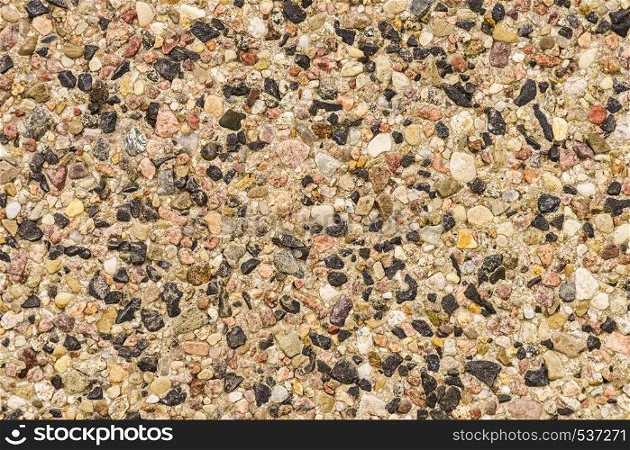 Detailed close up of texture pattern with brown black little stones and rocks. Abstract background concept.. Pattern texture brown stones pebbles