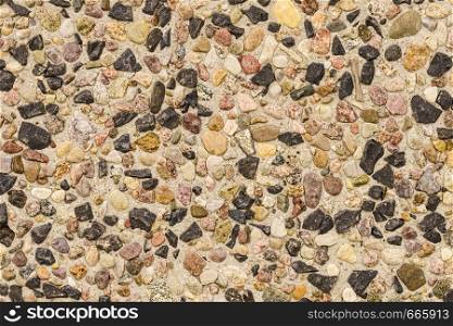 Detailed close up of texture pattern with brown black little stones and rocks. Abstract background concept.. Pattern texture brown stones pebbles