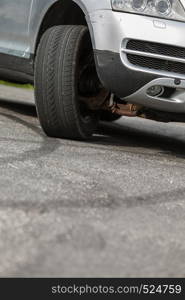 Detailed close up of twisted car wheel, automobile vehicle machine details concept.. Detailed closeup of twisted car wheel