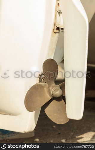 Detailed close up of white boat propeller. Details of nautical vessel sailing objects concept.. Close up of white boat propeller