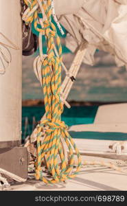 Detailed closeup of rigging on sail boat during cruise. Marine objects concept.. Detailed closeup of rigging on sail boat