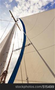 Detailed closeup of sail fabric on sailboat, outdoor shot. Marine objects concept.. Detailed closeup of sail on sailboat