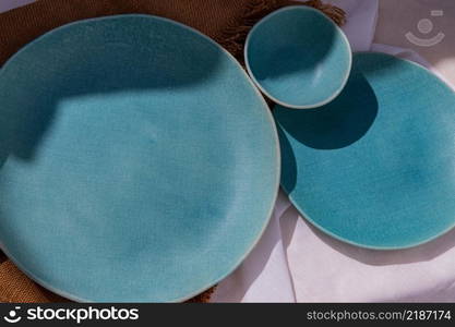 Detailed of Ceramic Plates on Sackcloth. Home decor, Ceramic tableware, Beautiful arrangement.