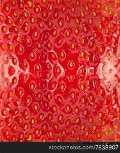 Detailed surface shot of a fresh strawberry.