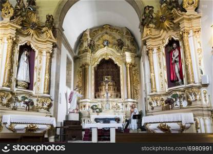 Detailed view of the main and side altars in Baroque architecture of the Church of Mercy in the city of Gouveia, Beira Alta, Portugal