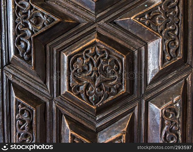 Details of a fine wood carving art on the door. An Islamic art and craft.. Details of fine wood carving art