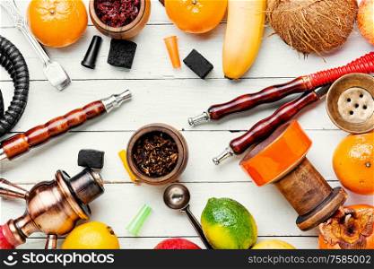 Details of a hookah and fruit smoking tobacco.Smoking hookah for relaxation.. Oriental fruit shisha