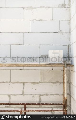 Details of house home construction site. Provisional walls made of grey blocks.. Details of house home construction site