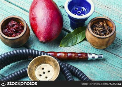 Details of the egyptian hookah.Shisha with mango flavor.Smoking apple tobacco. Smoking hookah with mango