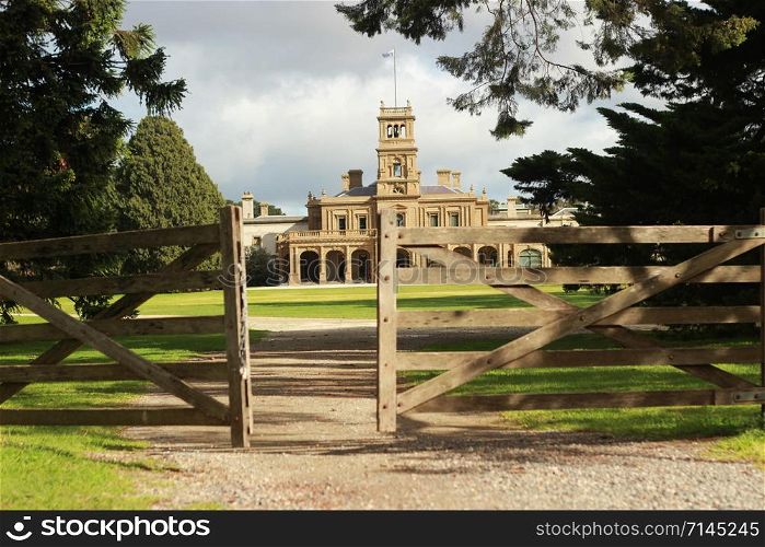 details of the old world architecture on the grand mansion viewed through the gardens at Werribee mansion, an old large Australian property near Melbourne Victoria, Australia