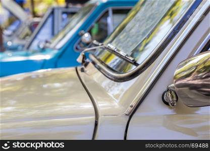 Details reto car show on street of the city. european and american old classic automobiles