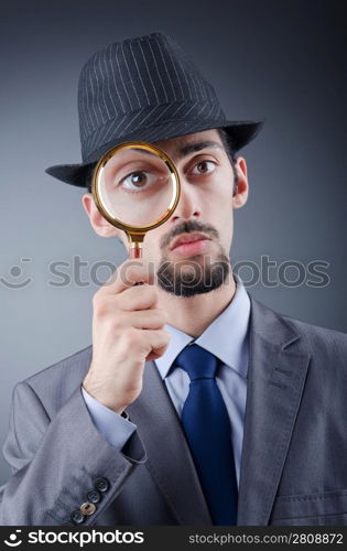 Detective and magnifying glass