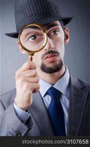 Detective and magnifying glass