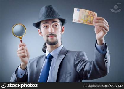 Detective looking at fake money