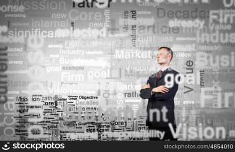 Determined in his business. Confident businessman with his arms crossed on chest