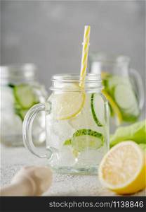 Detox diet. Fresh Summer Drink. Healthy detox fizzy lemonade with lemon and cucumber in mason jar. Healthy food concept.