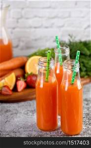 Detox drink. Freshly made Carrot Strawberry Orange Juice. For those who monitor their health