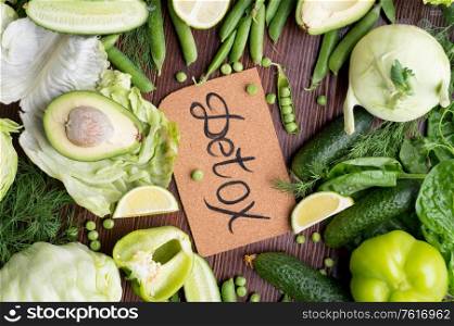 detox green vegetables lifestyle concept. various fresh green vegetables at wooden table. flat lay