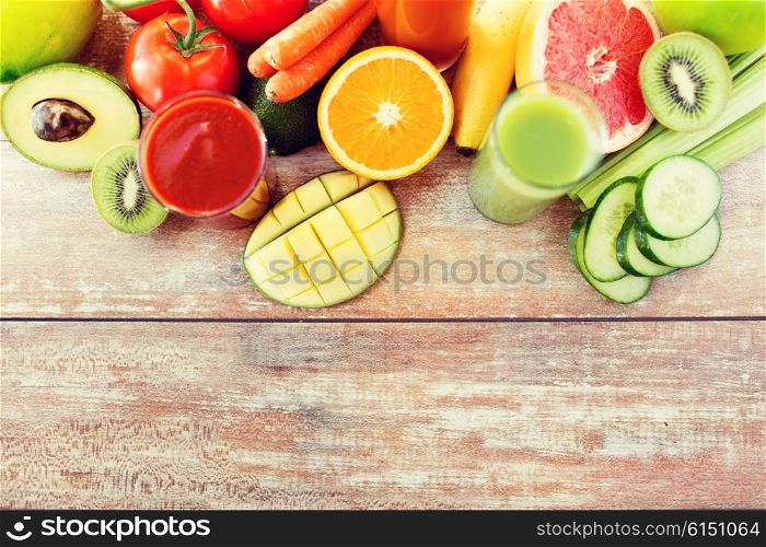 detox, healthy eating, food and diet concept - close up of fresh juice glass and fruits on table