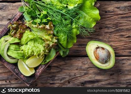 detox vegetable lettuce. Vegetarian salad with Lollo Rossa,avocado and lime.Salad leaf