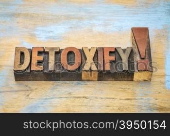detoxify exclamation in vintage letterpress wood type blocks stained by color inks - health concept